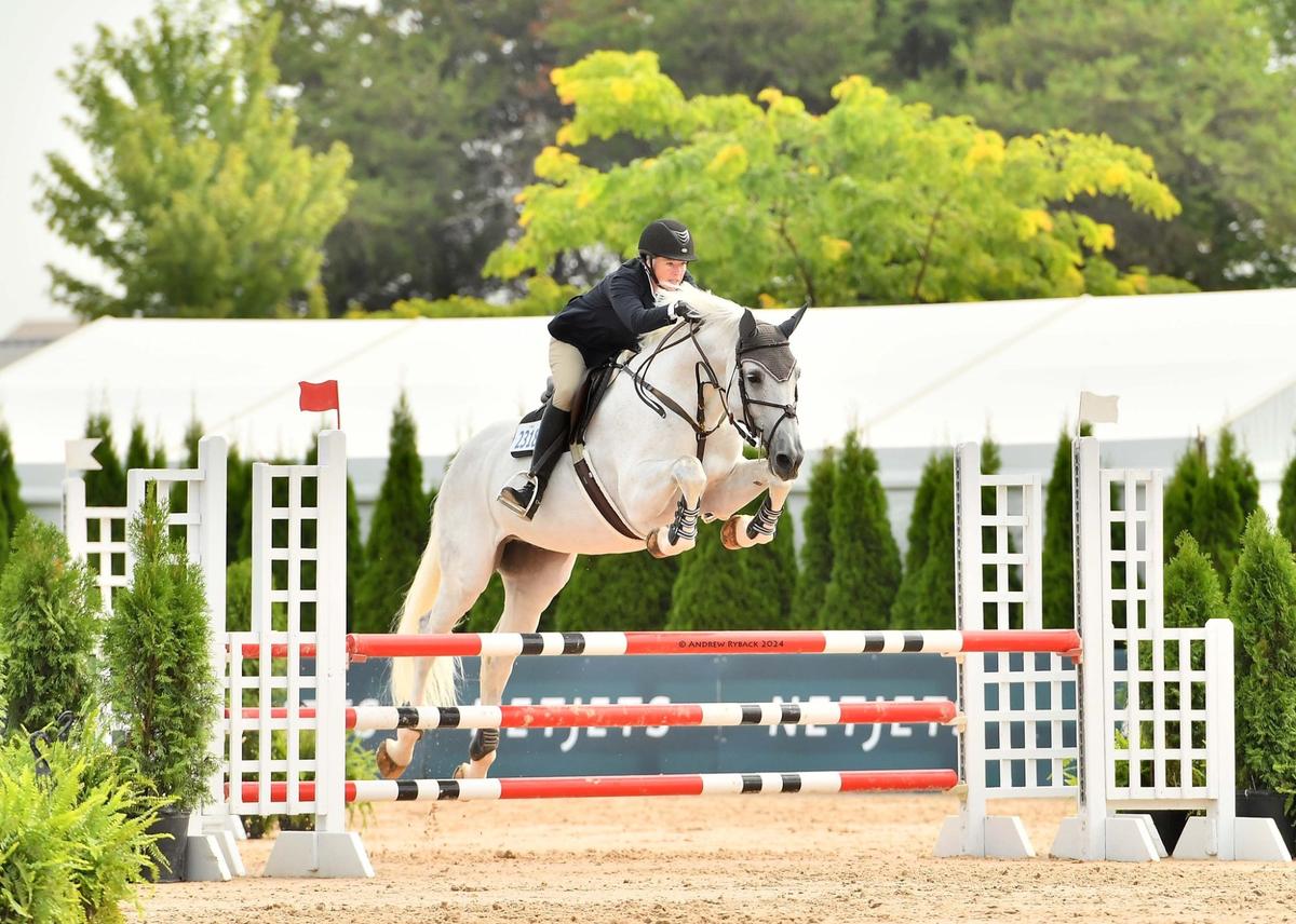 Chris competing in equestrian show jumping